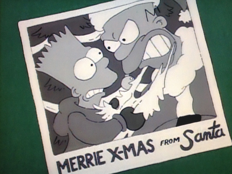 The Simpsons: Snapshot picture of Bart pulling out Homer's Santa beard in front of a Christmas tree. 