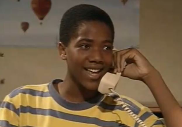 A young J. August Richards as Roy on the phone with Vanessa in The Cosby Show