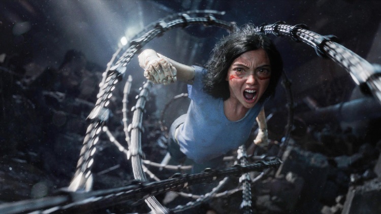 Screen shot of Rosa Salazar as Alita fighting her way out.