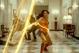 A screenshot from 'Wonder Woman 1984' featuring Gal Gadot as Wonder Woman as she works her golden lasso