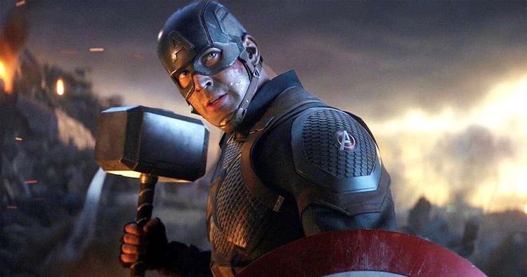 Captain America holding Thor's hammer