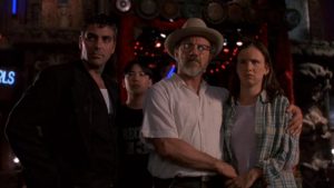 A still from the movie, From Dusk Till Dawn, featuring George Clooney, Ernest Liu, Harvey Keitel, and Juliette Lewis
