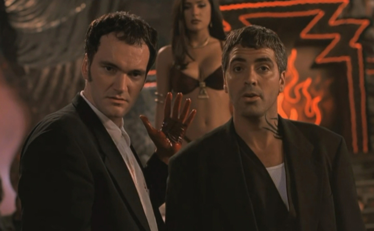 A still from the movie, From Dusk Till Dawn, featuring Quentin Tarantino, Salma Hayek, and George Clooney