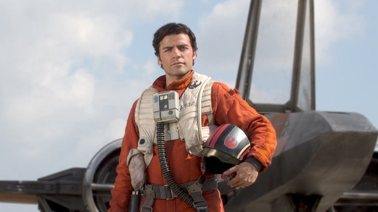 Oscar Isaac as Poe Dameron standing in front of a fighter plane