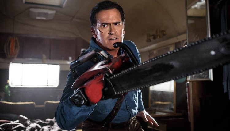 Actor Bruce Campbell showing off his chainsaw hand in a still from the Ash vs. Evil Dead TV show on Starz.
