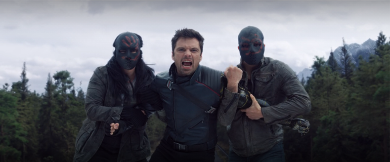 Bucky (Sebastian Stan) shouts at Sam as he's subdued by two Flag Smasher soldiers in a still from "The Falcon and the Winter Solder" on Disney+.