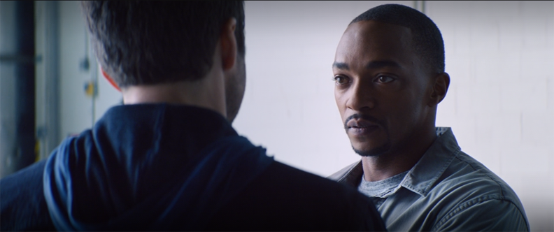 Sam (Anthony Mackie) discusses his troubles with Bucky (Sebastian Stan) in a still from "The Falcon and the Winter Solder" on Disney+.