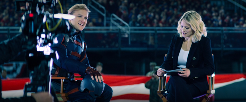 John Walker (Wyatt Russell) sits down for an interview to discuss becoming the new Captain America in a still from "The Falcon and the Winter Solder" on Disney+.