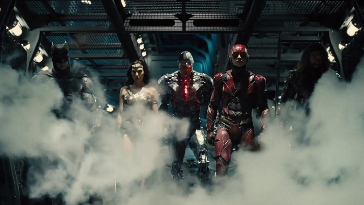 A hero shot from 'Zack Snyder's Justice League'  featuring Batman, Wonder Woman, Cyborg, the Flash, and Aquaman surrounded by a plume of smoke