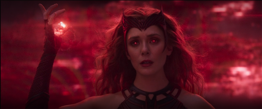 Wanda (Elizabeth Olsen) succumbs to her destiny as the Scarlet Witch in a still from the Disney+ show "WandaVision."
