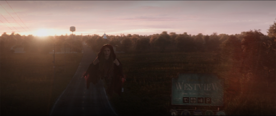 Wanda (Elizabeth Olsen) leaves Westview, NJ after removing the hex around the town in a still from the Disney+ show "WandaVision."