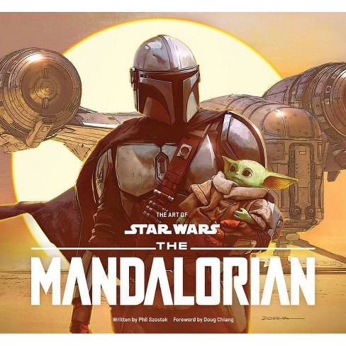 The Mandalorian and baby Grogu on the front cover of The Art of Star Wars: The Mandalorian book.