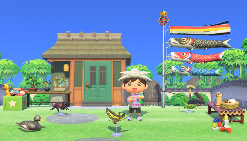 An islander smiles happily outside a house decorated with fish flags and bug models in a screen capture from "Animal Crossing: New Horizons."