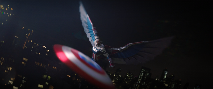 Captain AMerica (Anthony Mackie) throws his shield as he flies through the air in a still from the Disney+ series "The Falcon and the Winter Soldier."