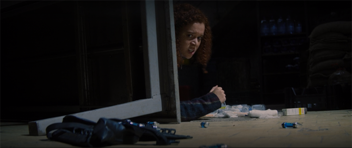 Karli (Erin Kellyman) takes cover from Zemo's gunfire in a still from "The Falcon and the Winter Soldier" on Disney+.