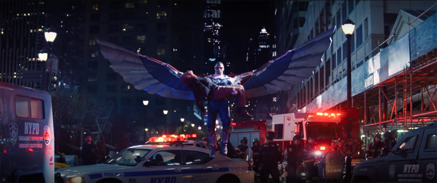 Sam (Anthony Mackie) flies Karli (Erin Kellyman) into a crowd of authorities in a still from the Disney+ series "The Falcon and the Winter Soldier."