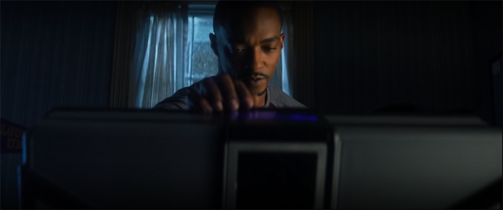 Sam (Anthony Mackie) opens the case given to him by the Wakandans in a still from the Disney+ series "The Falcon and the Winter Soldier."