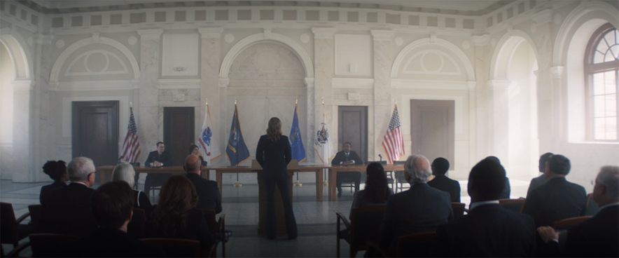 Sharon Carter (Emily VanCamp) receives her pardon from a panel of US representatives in a still from the Disney+ series "The Falcon and the Winter Soldier."