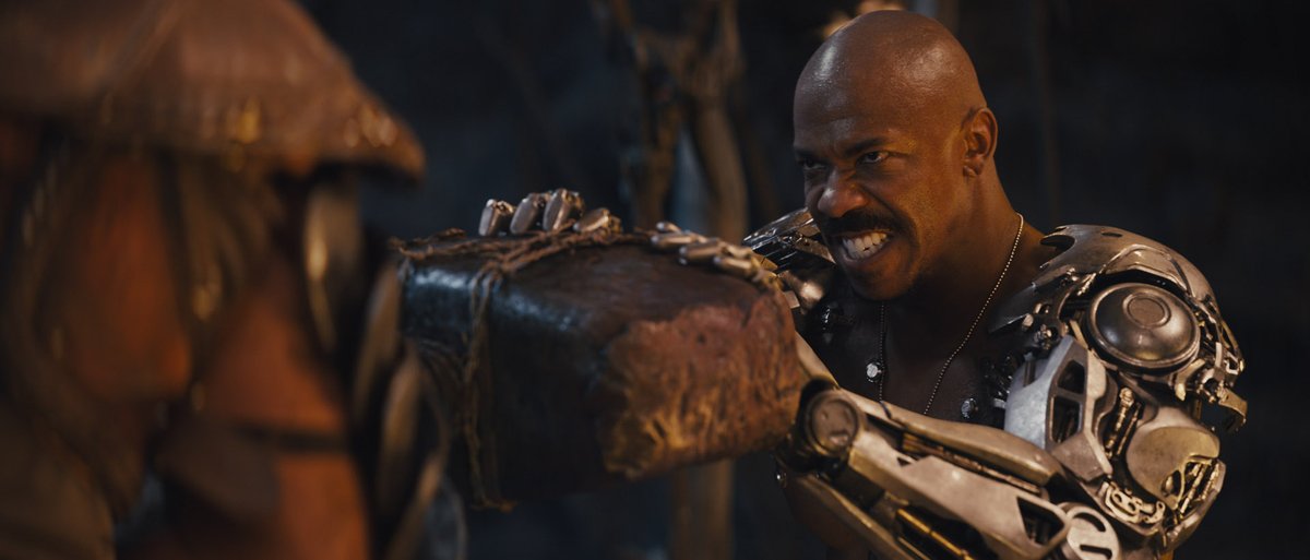 Jax (Mechad Brooks) struggles against the stone hammer of Reiko in a still from the New Line Cinemas film "Mortal Kombat."