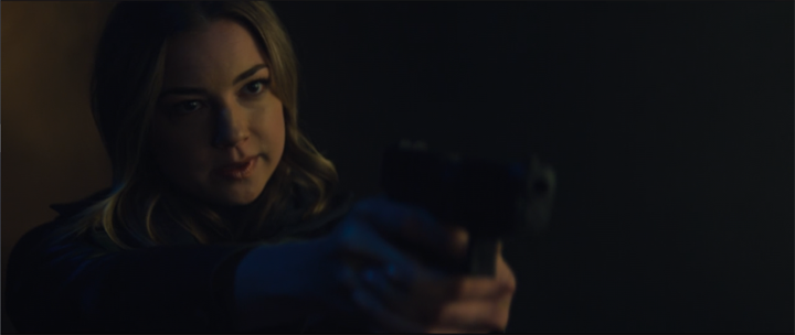 Sharon Carter (Emily VanCamp) aims a gun at Sam, Bucky, and Zemo. 