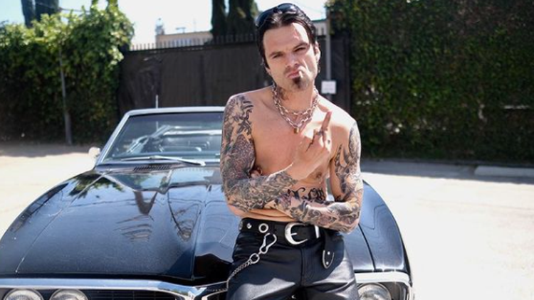 Sebastian Stan shared a photo of himself as rock star Tommy Lee of Mötley Crüe in which he is shirtless, covered in tattoos and sporting a goatee and leather pants.