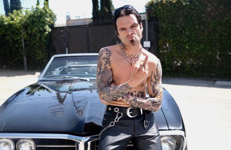 Sebastian Stan shared a photo of himself as rock star Tommy Lee of Mötley Crüe in which he is shirtless, covered in tattoos and sporting a goatee and leather pants.