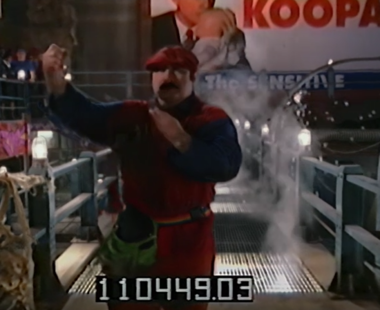 Mario Holds up a necklace