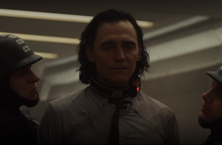 Loki (Tom Hiddleston) offers no resistance to his TVA guards in a still from the Disney+ series 
