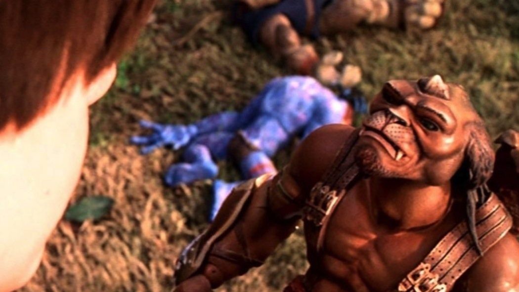 Alan Abernathy (Gregory Smith) says goodbye to Archer, a sentient toy voiced by Frank Langella in a still from the 1998 film "Small Soldiers."