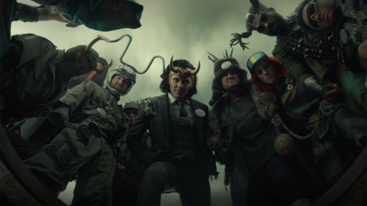 President Loki (Tom Hiddleston) and his band of minions look down on 2012 Loki in a still from the Disney+ series "Loki."