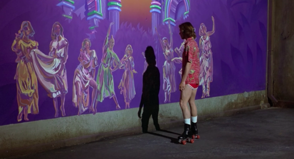 Michael Beck looking at a painting of all the Muses in Xanadu.