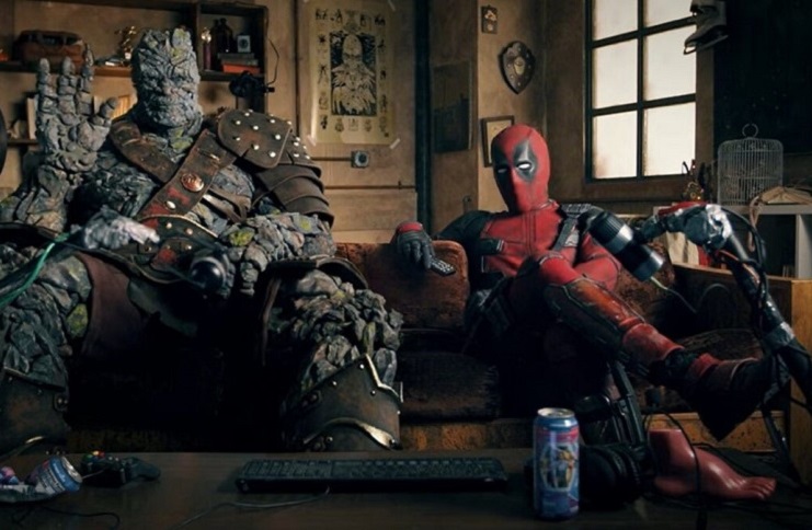 taika waititi as Korg and Ryan Reynolds as Deadpool, sitting on a couch in promo for Free Guy