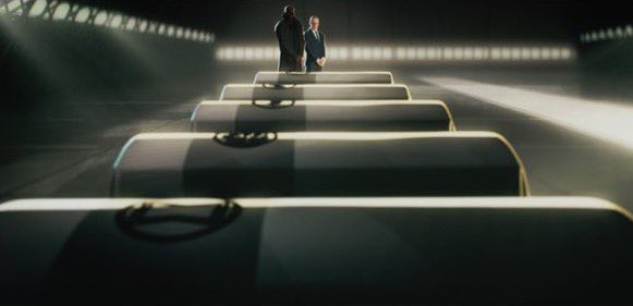 Nick Fury and Coulson look over the coffins of the fallen Avengers in a still from the Disney+ series "What If...?"