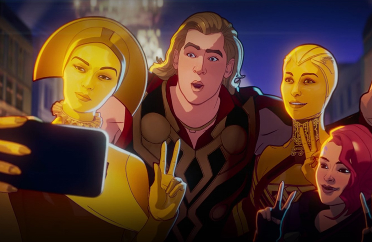 Thor poses for a picture with two Sovereign aliens in a still from the Disney+ series 