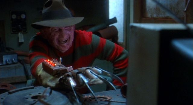 Freddy Kruger (Robert Englund) plays with his victims before murdering them, such as trapping a gamer in a giant video game in a still from "Freddy's Dead: The Final Nightmare."