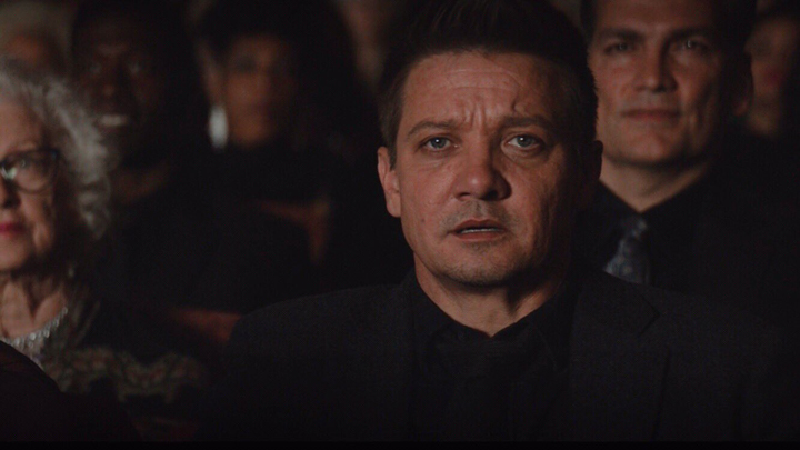 Clint Barton (Jeremy Renner) watches the stage in shameful fascination in a still from the Disney+ series "Hawkeye."