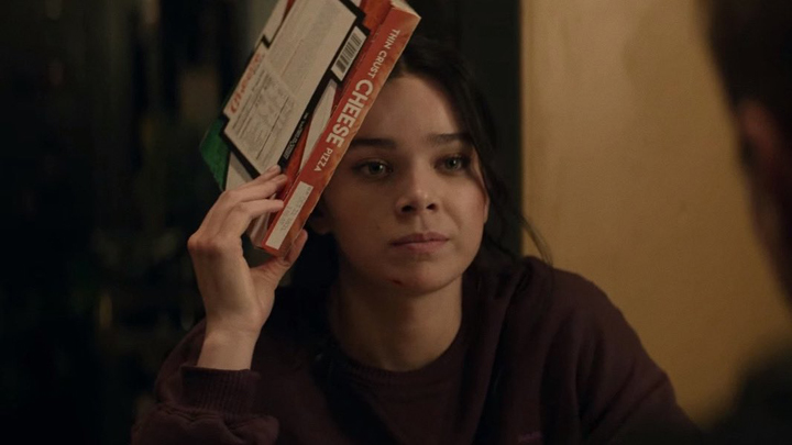 Kate Bishop (Hailee Steinfeld) uses a frozen pizza to lessen the swelling on her head in a still from the Disney+ series "Hawkeye."