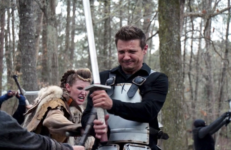 Clint Barton (Jeremy Renner) uses his fighting skills to best a group of LARPers in a still from the Disney+ series 