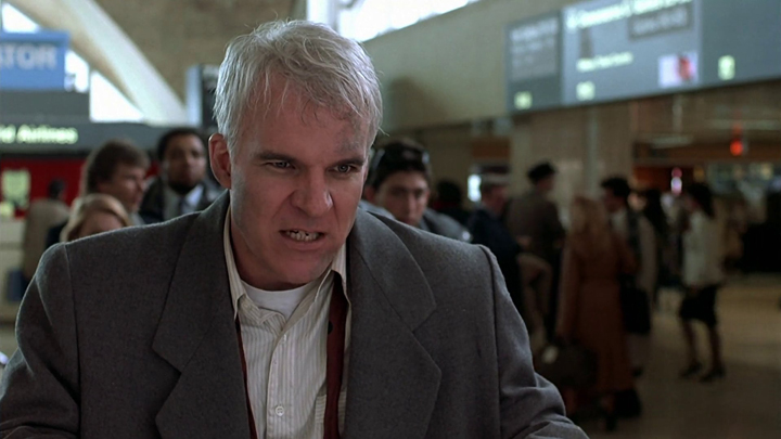 Neal Page (Steve Martin) explodes on a mild-mannered car rental clerk when his plans to travel home for Thanksgiving go awryin a still from "Planes, Trains and Automobiles."