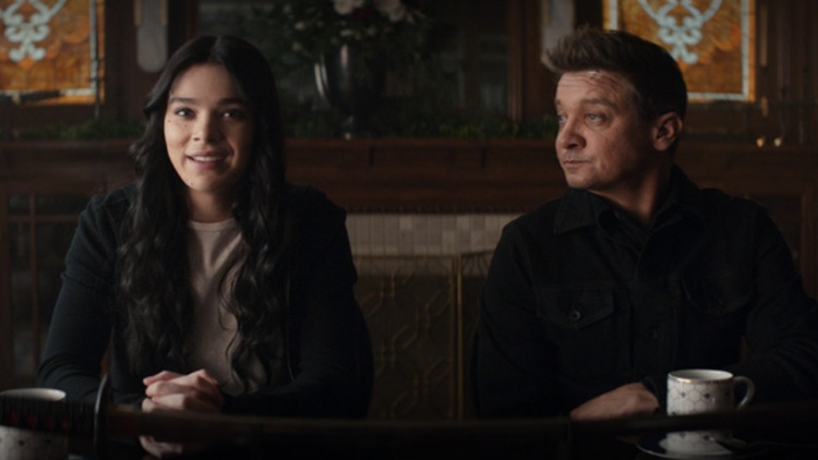 Kate Bishop (Hailee Steinfeld) explains to her mother how she's helping Clint Barton (Jeremy Renner) in a still from the Disney+ series "Hawkeye."