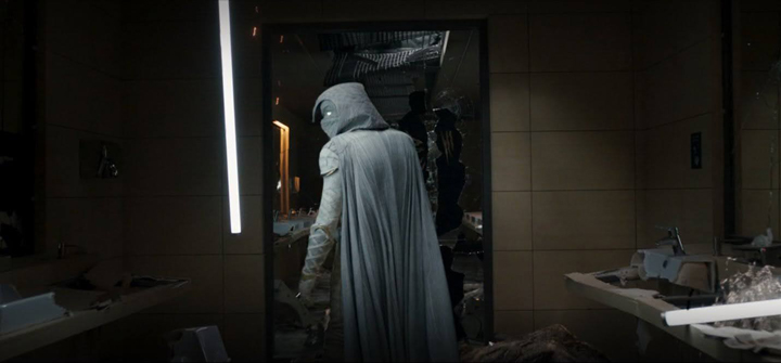 Moon Knight (Oscar Isaac) stands triumphant after taking down a vicious creature in a still from the Disney+ series "Moon Knight."