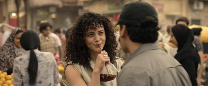 Layla (May Calamawy) give Marc Spector (Oscar Isaac) a cheeky smile in a still from the Disney+ series "Moon Knight."
