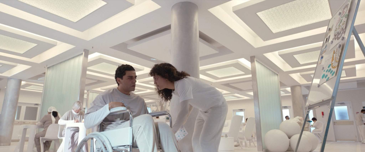 Marc Spector (Oscar Isaac) wakes up in a mental hospital to find a manic Layla (May Calamawy) in a still from the Disney+ series "Moon Knight."
