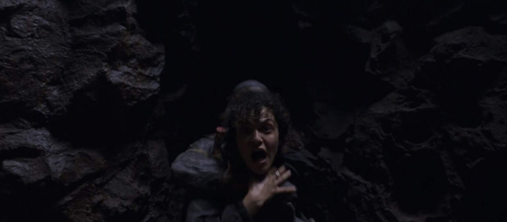Layla (May Calamawy) is pulled into a dark crevice by a mummy-like creature in a still from the Disney+ series "Moon Knight."