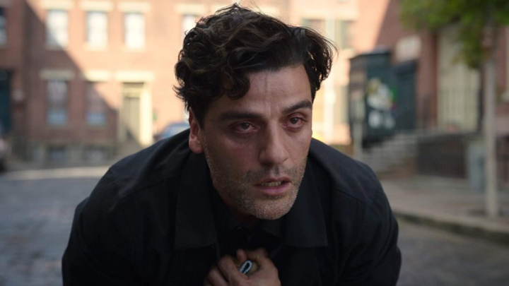 Marc Spector (Oscar Isaac) crumbles in grief after the death of his mother in a still from the Disney+ series "Moon Knight."