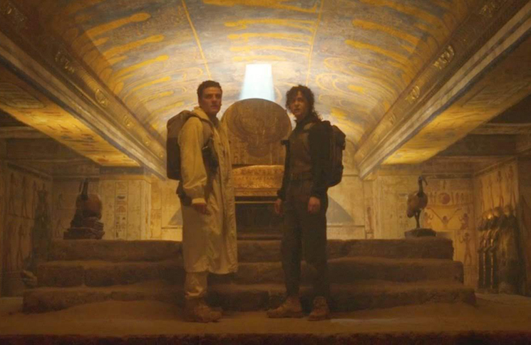 Marc Spector (Oscar Isaac) and Layla (May Calamawy) stand in front of an ancient sarcophagus in a still from the Disney+ series 