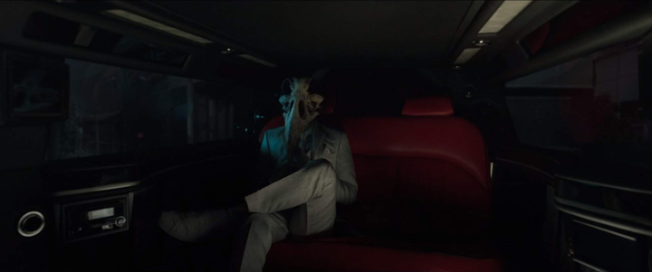 Khonshu (voiced by Frank Langella) shows off his drip in the back of a limo in a still from the Disney+ series "Moon Knight."
