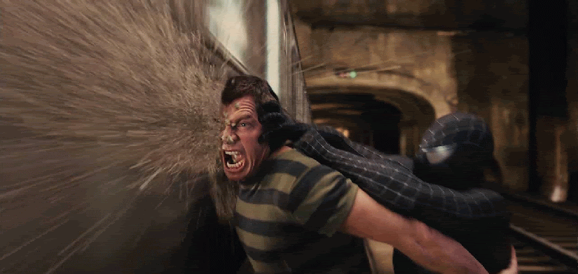 A black-suited Spider-Man forces Sandman's (Thomas Hayden Church) face into a train in a still from "Spider-Man 3."