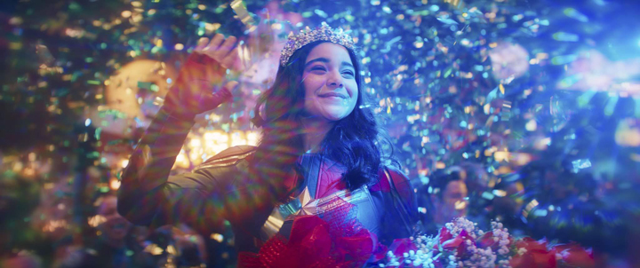 Kamala Khan (Iman Vellani) imagines herself crowned the winner of the Captain Marvel costume contest in a still from the Disney+ series "Ms. Marvel."
