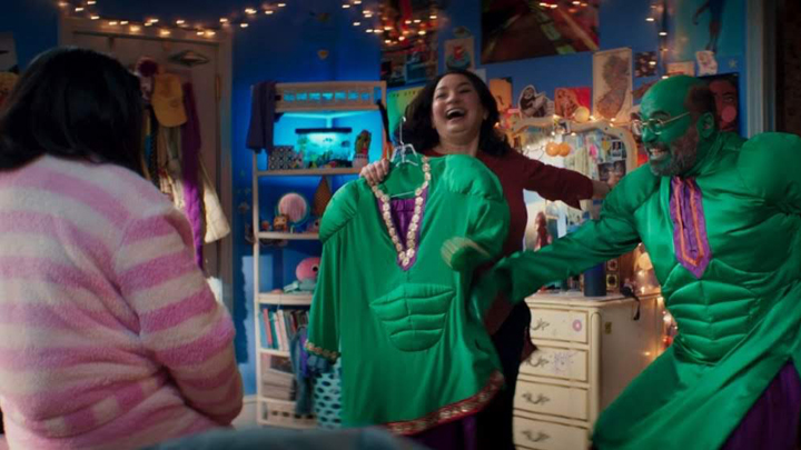 Kamala's parents (Zenobia Shroff, Mohan Kapur) are excited to show her the Pakistani-Hulk costumes in a still from the Disney+ series "Ms. Marvel."